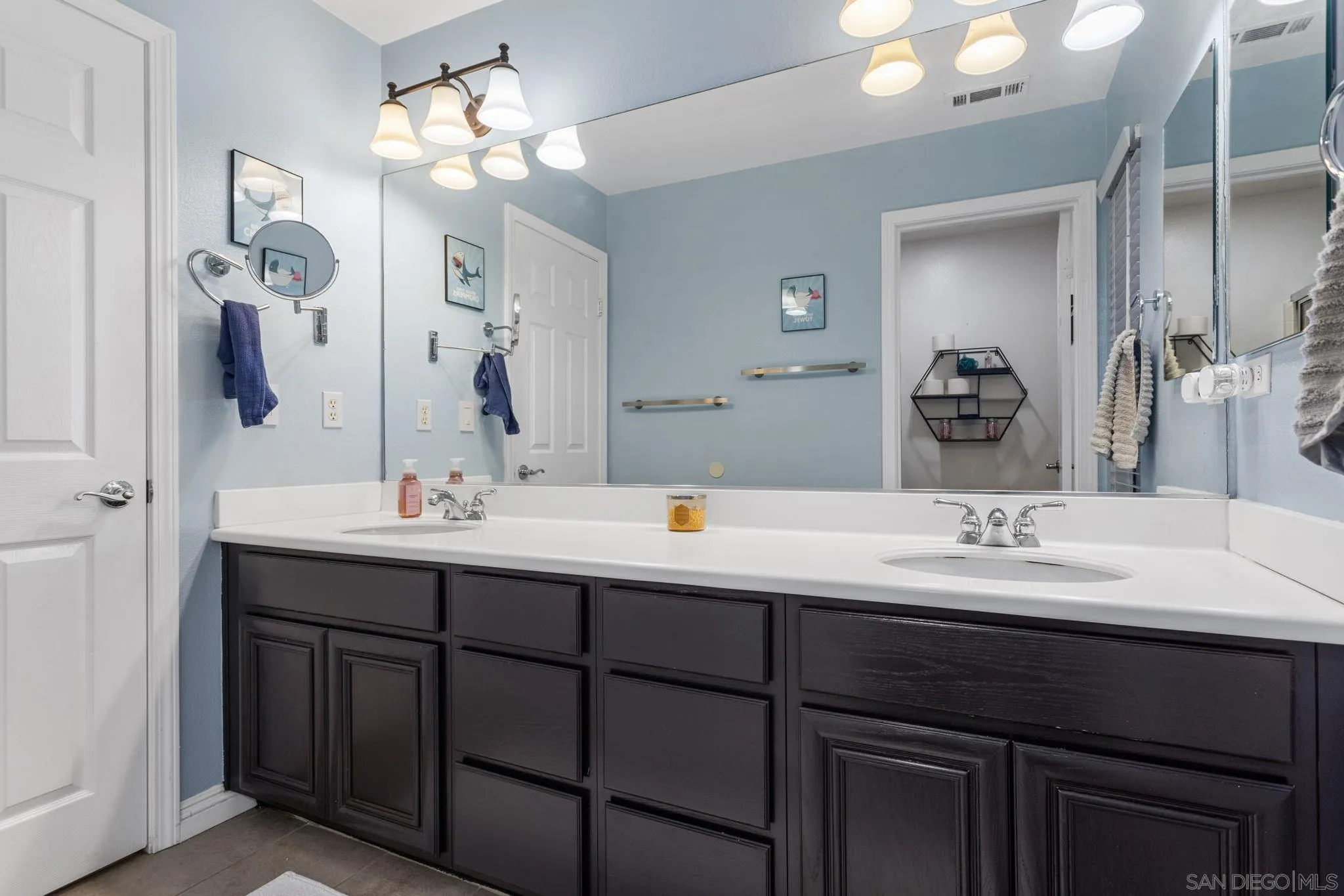 2103 Drew Road Escondido, CA 92027 - Photo 37 of 60 a bathroom with a sink and a mirror