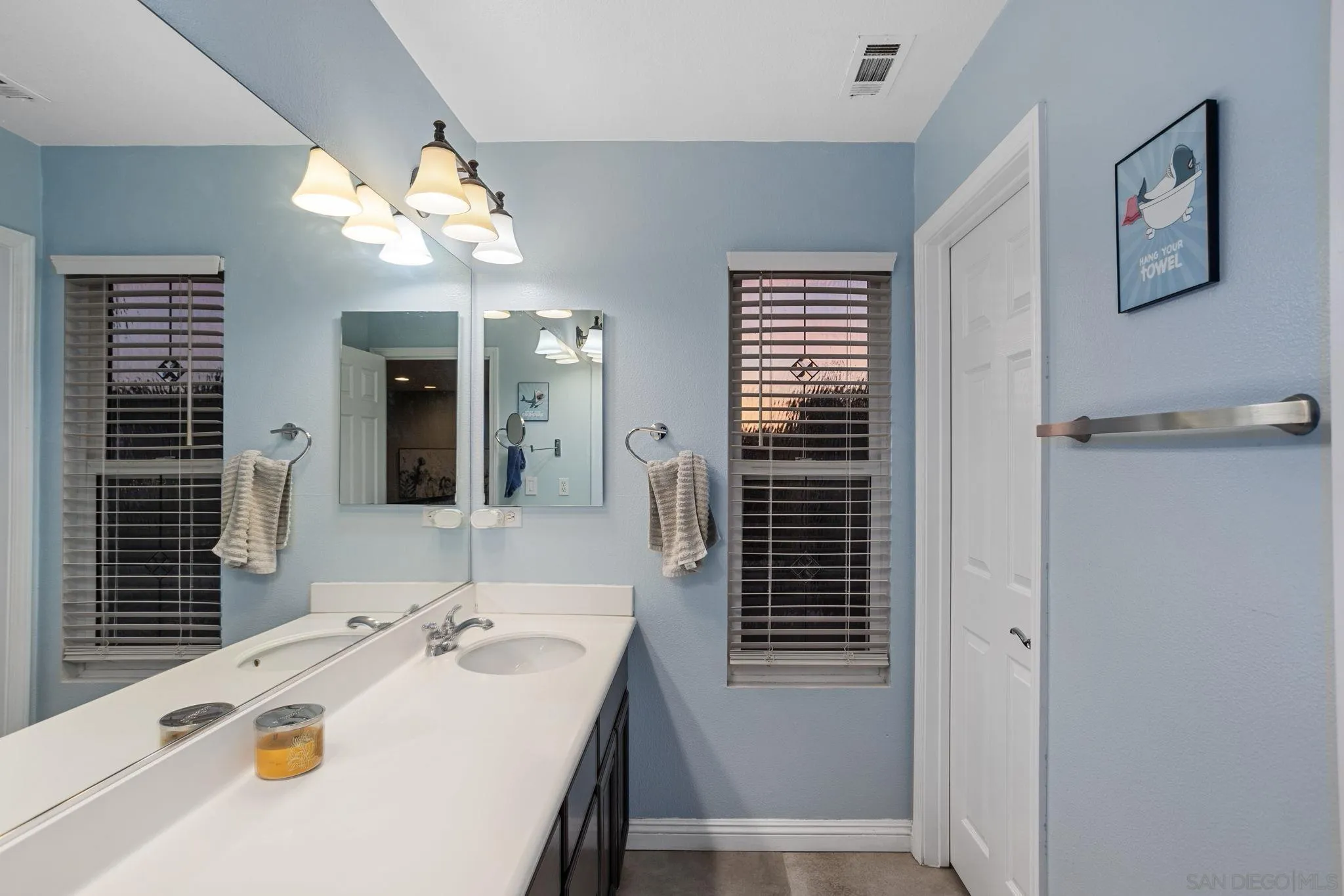 2103 Drew Road Escondido, CA 92027 - Photo 38 of 60 a bathroom with a tub sink and mirror