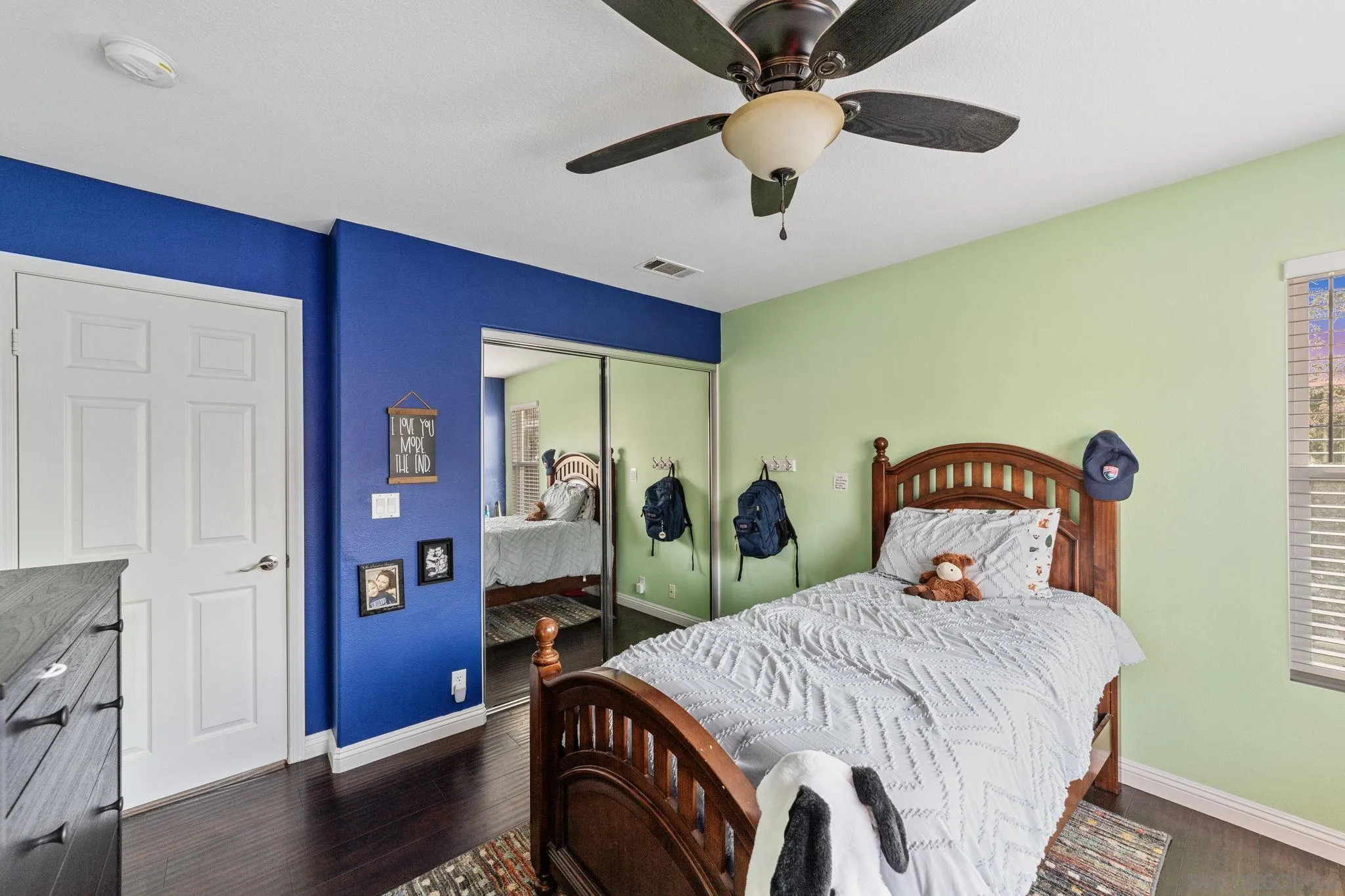 2103 Drew Road Escondido, CA 92027 - Photo 42 of 60 a bedroom with a bed and a chandelier