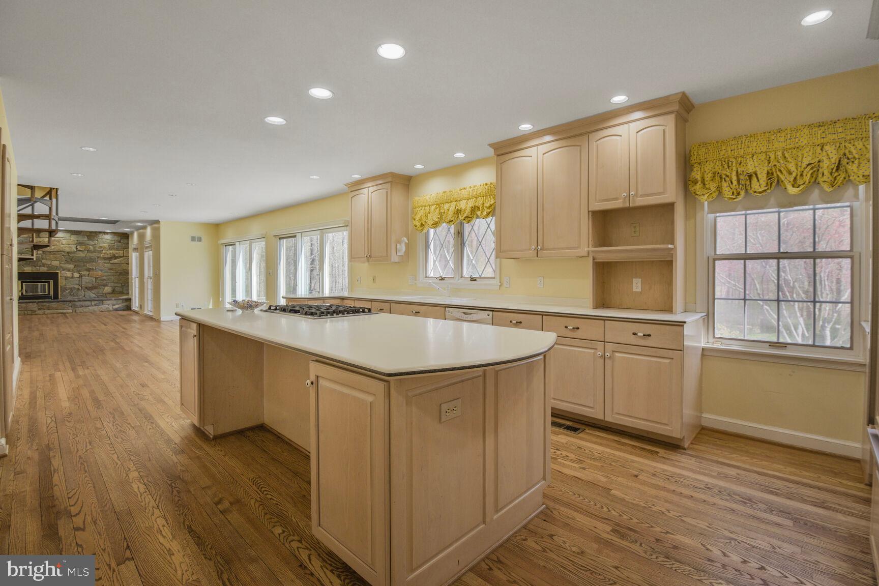10101 Bentcross Drive Potomac, MD 20854 - Photo 12 of 44 a kitchen with counter top space and wooden floor