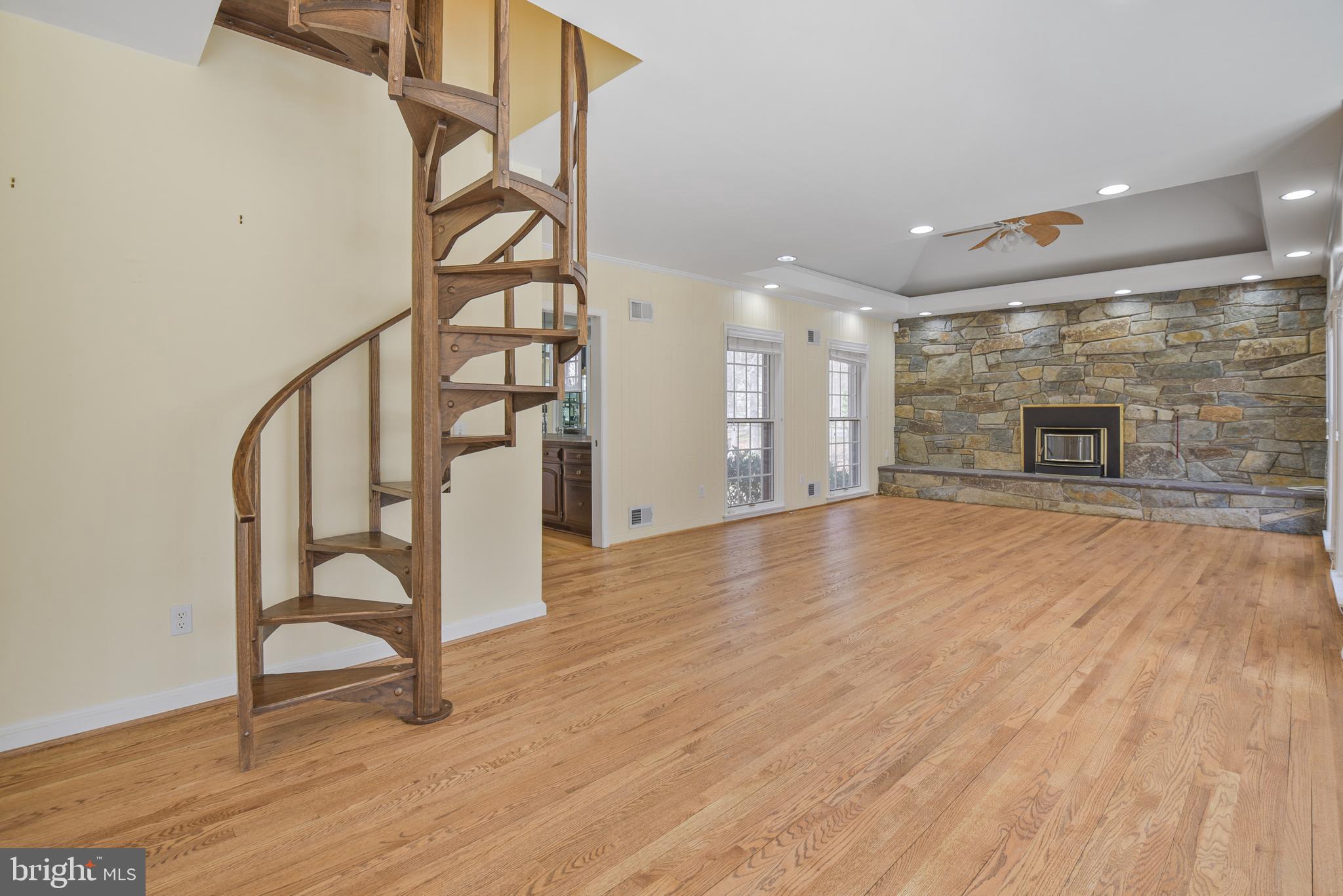 10101 Bentcross Drive Potomac, MD 20854 - Photo 17 of 44 a view of an empty room with wooden floor and a window