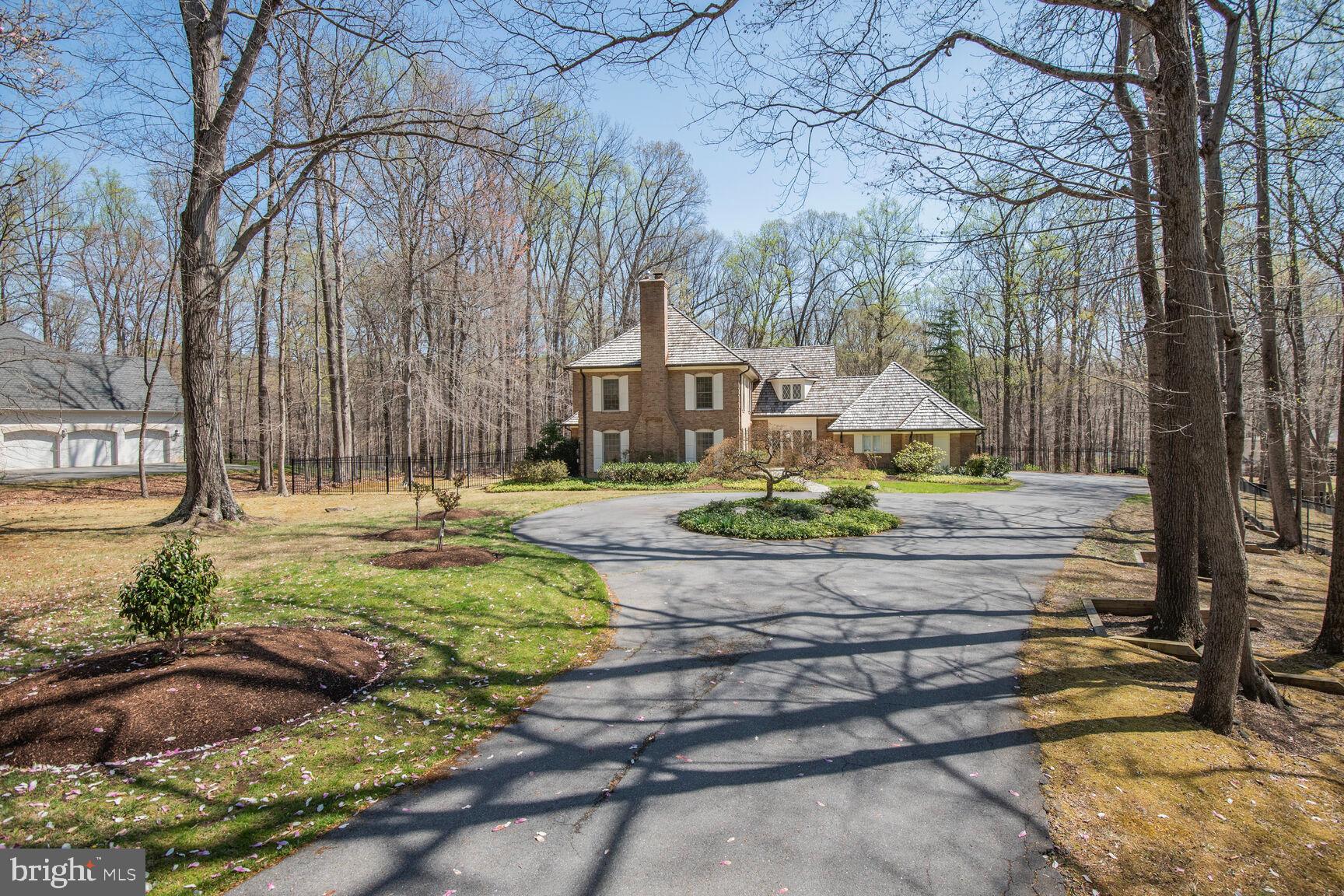 10101 Bentcross Drive Potomac, MD 20854 - Photo 2 of 44 a front view of a house with a yard