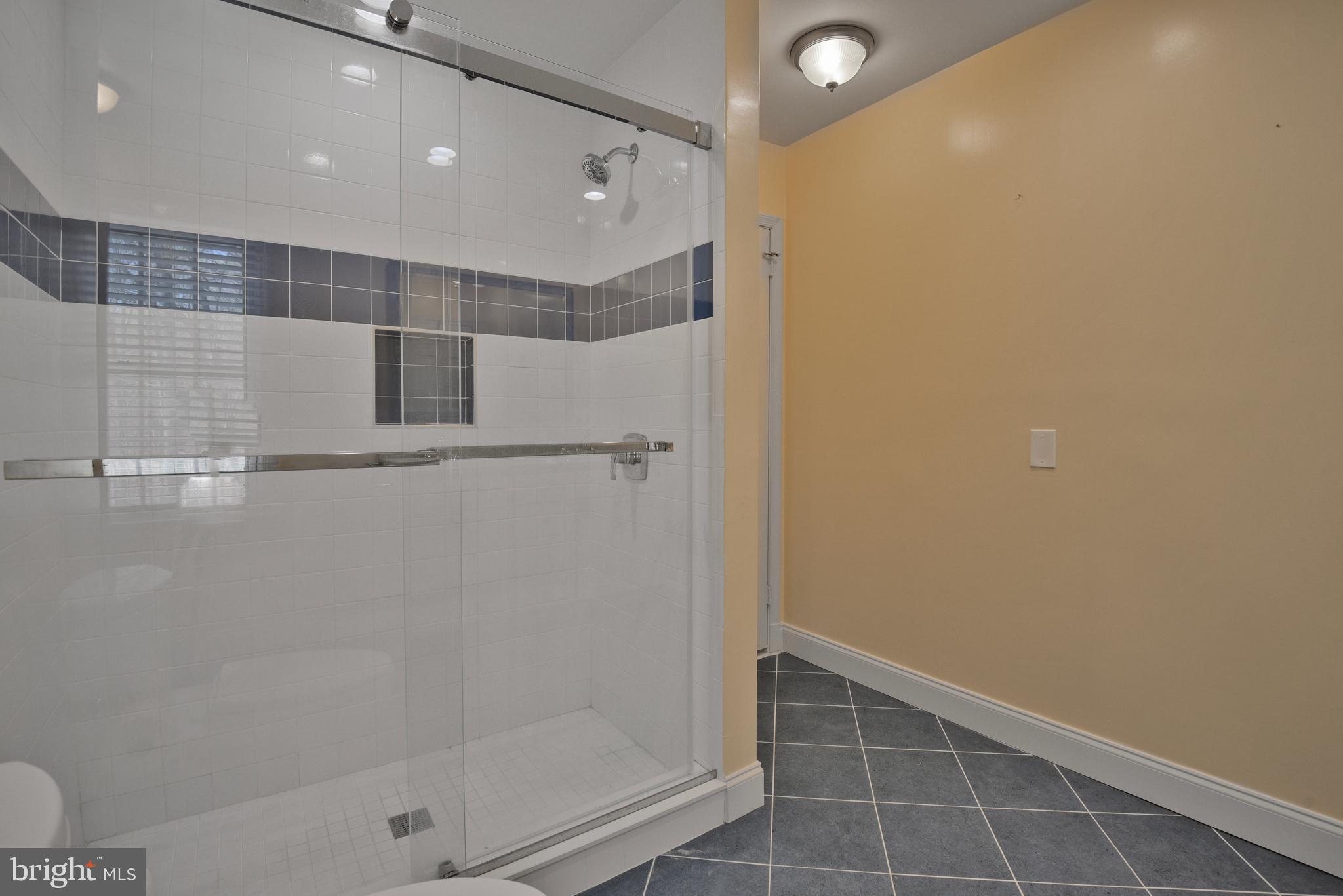 10101 Bentcross Drive Potomac, MD 20854 - Photo 30 of 44 a bathroom with a shower