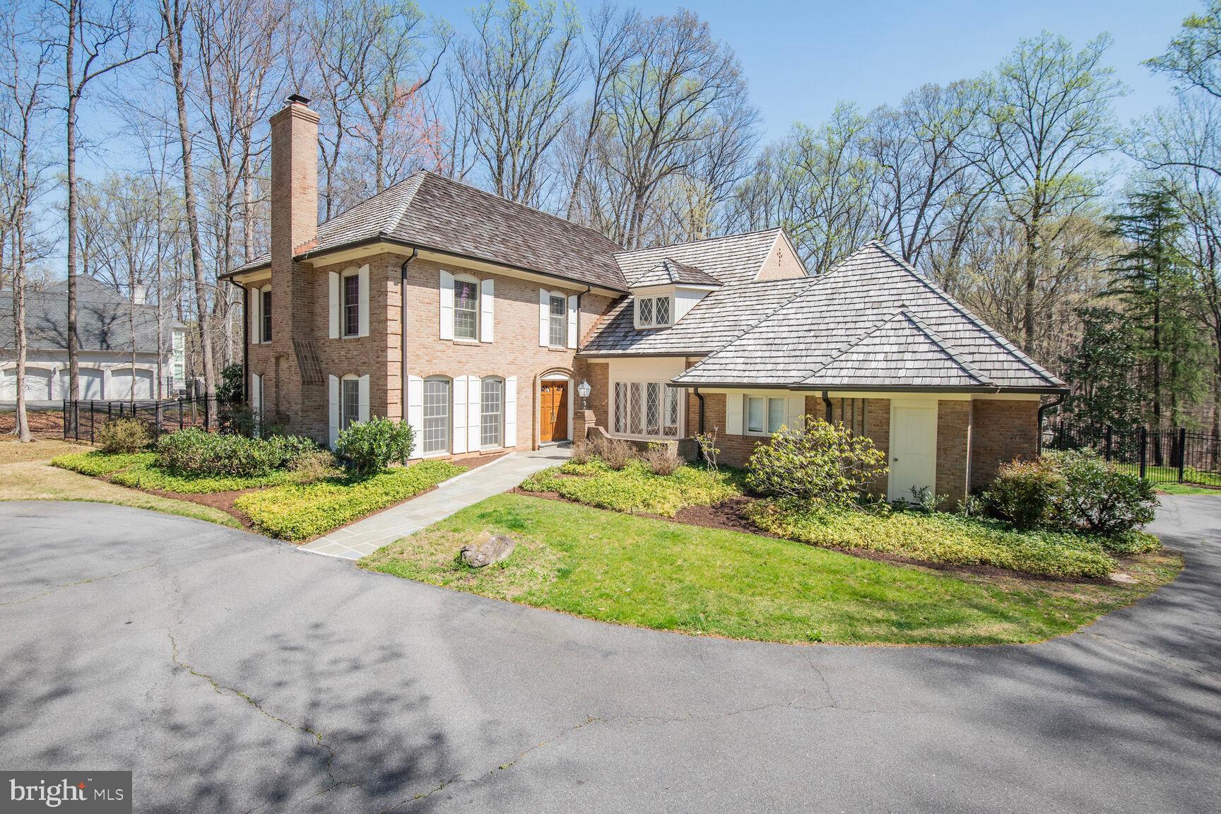10101 Bentcross Drive Potomac, MD 20854 - Photo 3 of 44 a front view of a house with a yard and porch