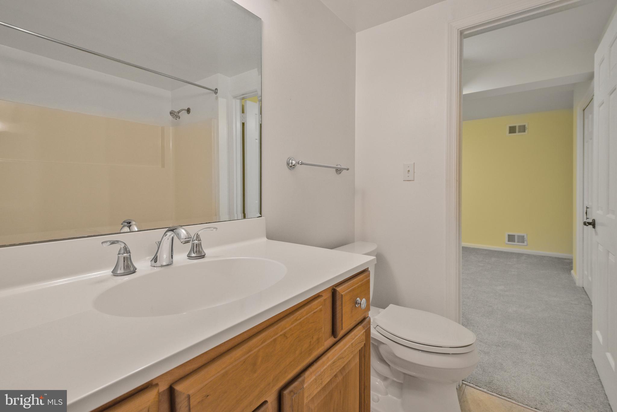 10101 Bentcross Drive Potomac, MD 20854 - Photo 33 of 44 a bathroom with a sink a toilet and shower