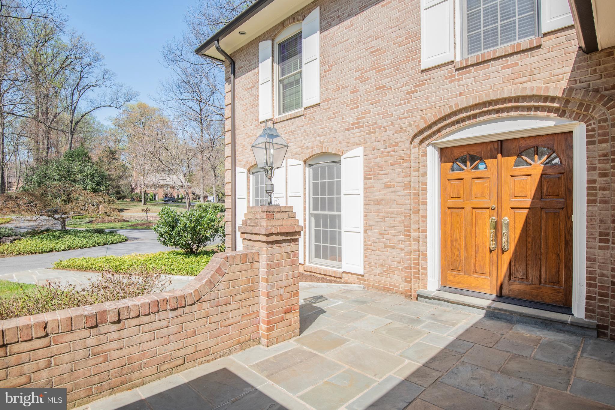 10101 Bentcross Drive Potomac, MD 20854 - Photo 4 of 44 a front view of a house with garden