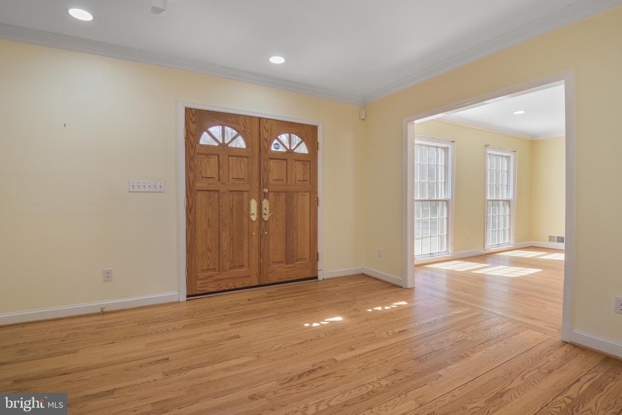 10101 Bentcross Drive Potomac, MD 20854 - Photo 5 of 44 wooden floor in an empty room with a window
