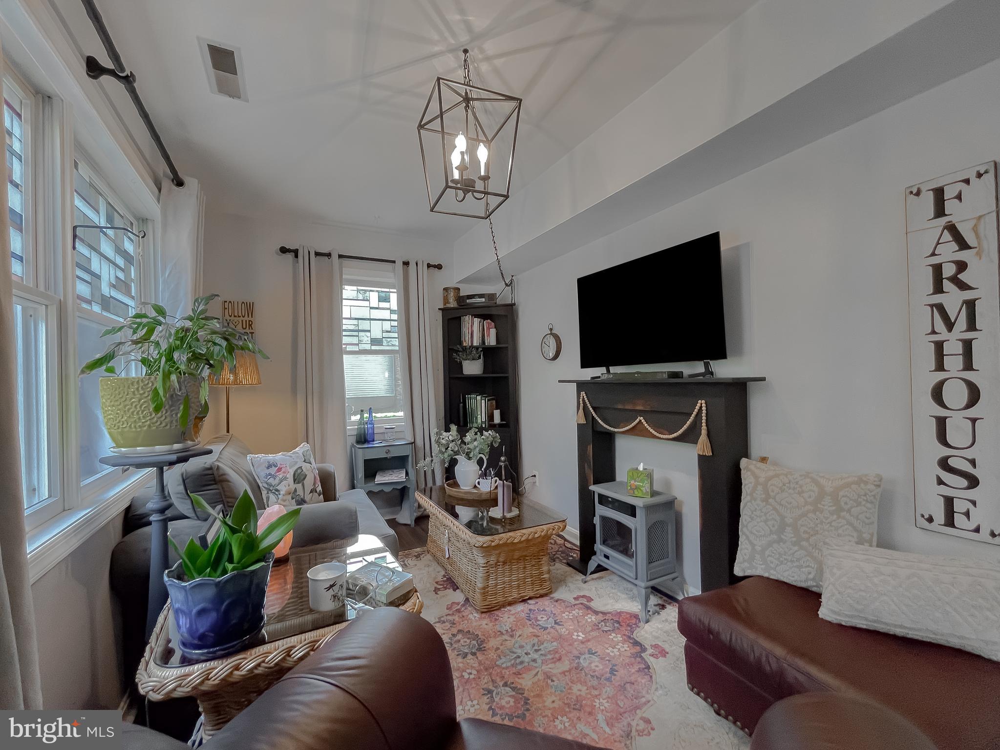 22338 White Oak Road Leonardtown, MD 20650 - Photo 14 of 66 a living room with furniture and a flat screen tv