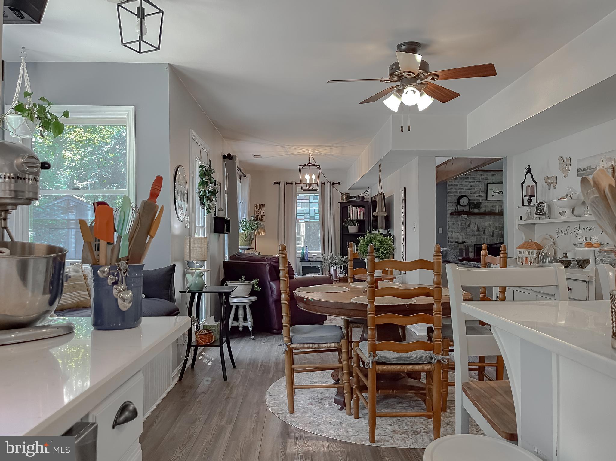22338 White Oak Road Leonardtown, MD 20650 - Photo 16 of 66 a view of a dining room with furniture window and wooden floor