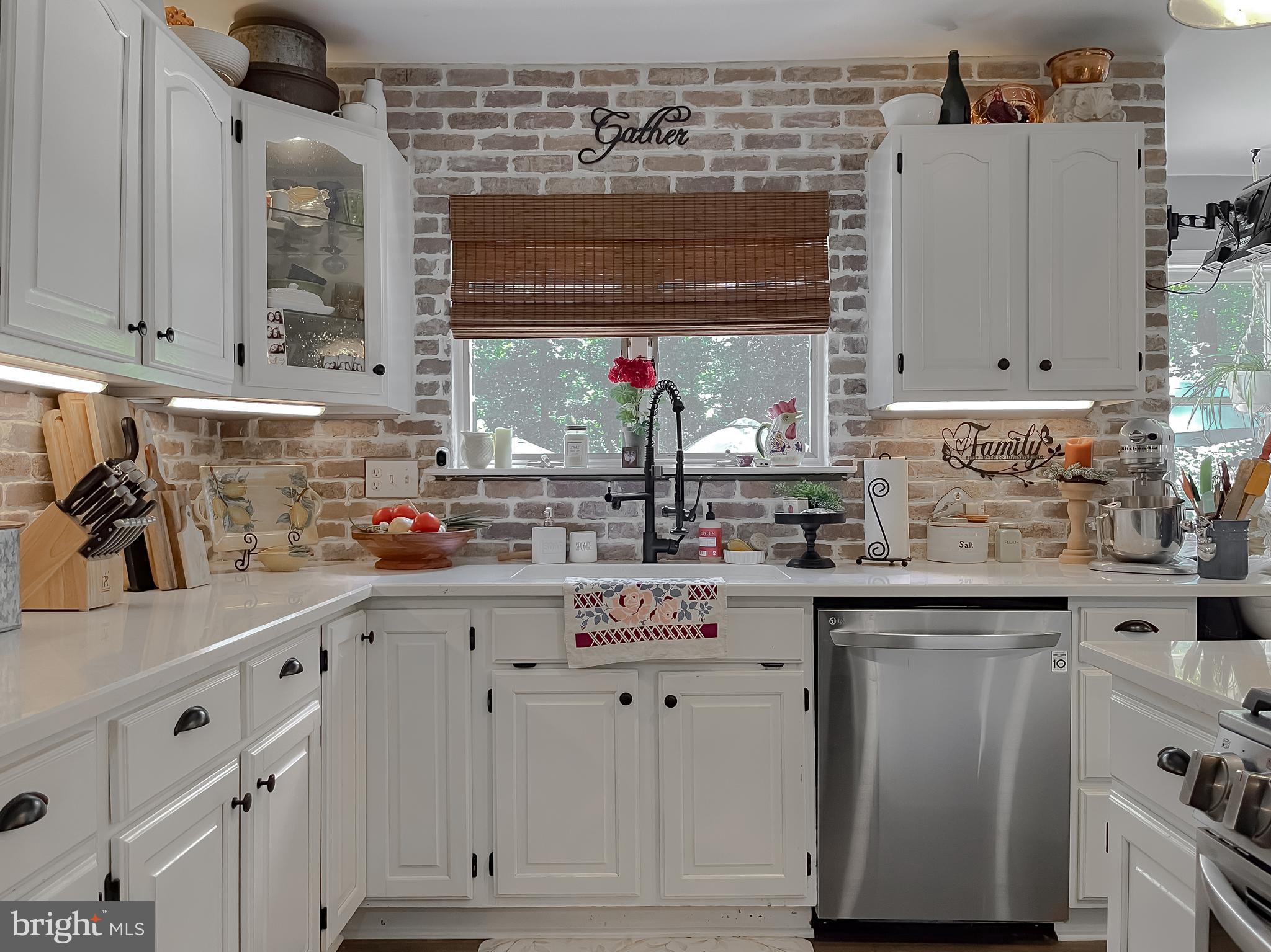 22338 White Oak Road Leonardtown, MD 20650 - Photo 18 of 66 a kitchen with stainless steel appliances granite countertop a sink and cabinets