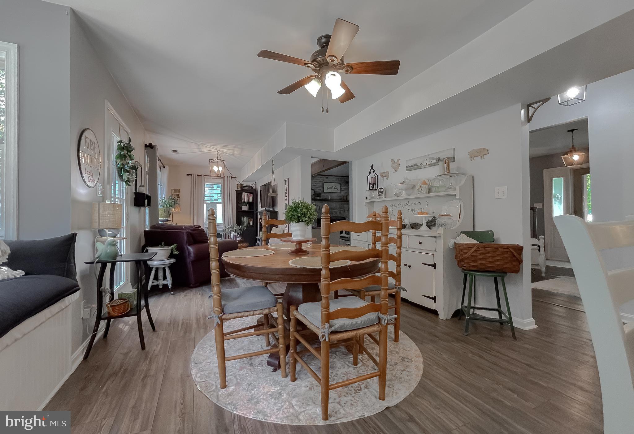 22338 White Oak Road Leonardtown, MD 20650 - Photo 19 of 66 a living room with furniture and kitchen view