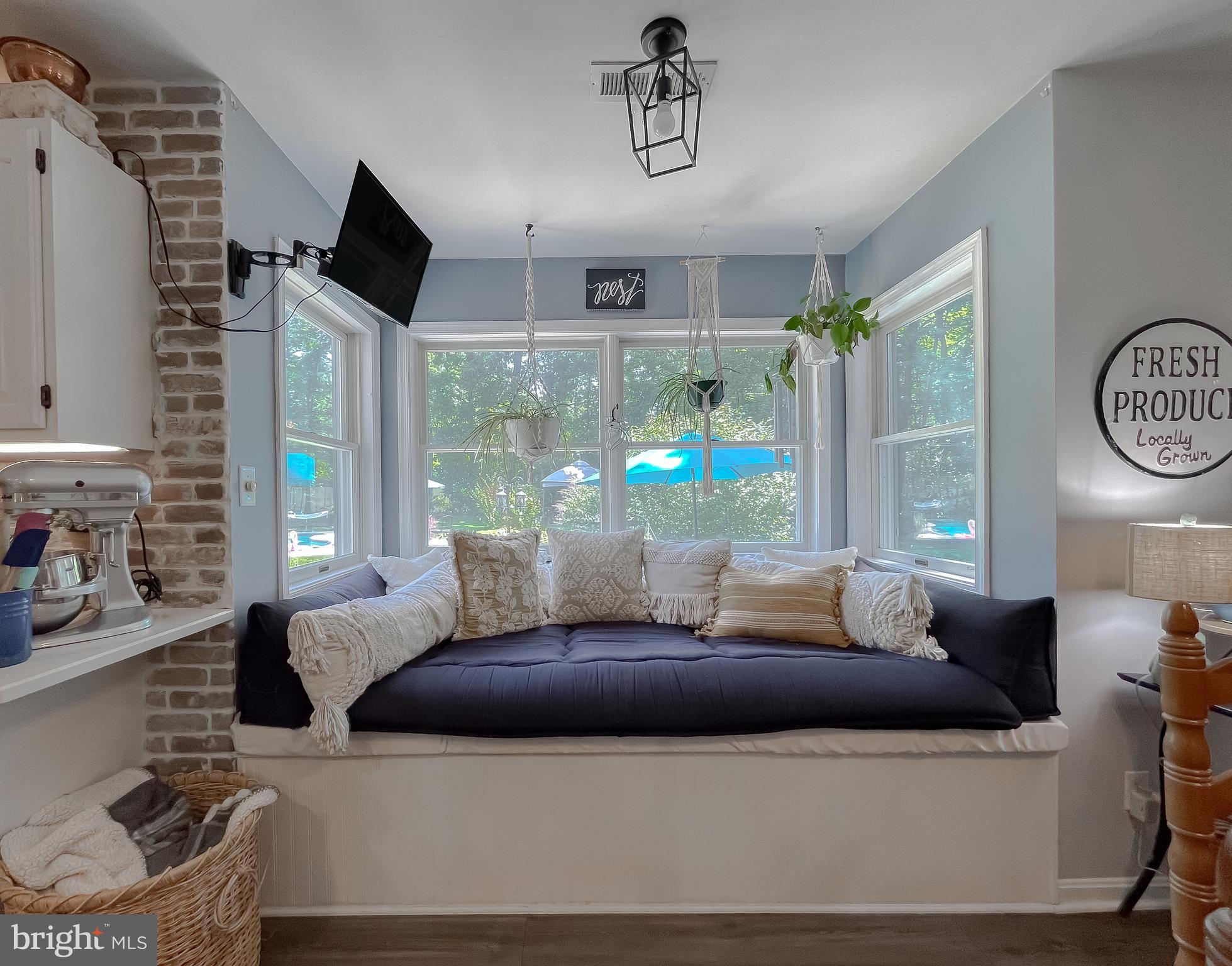 22338 White Oak Road Leonardtown, MD 20650 - Photo 21 of 66 a living room with furniture and a large window