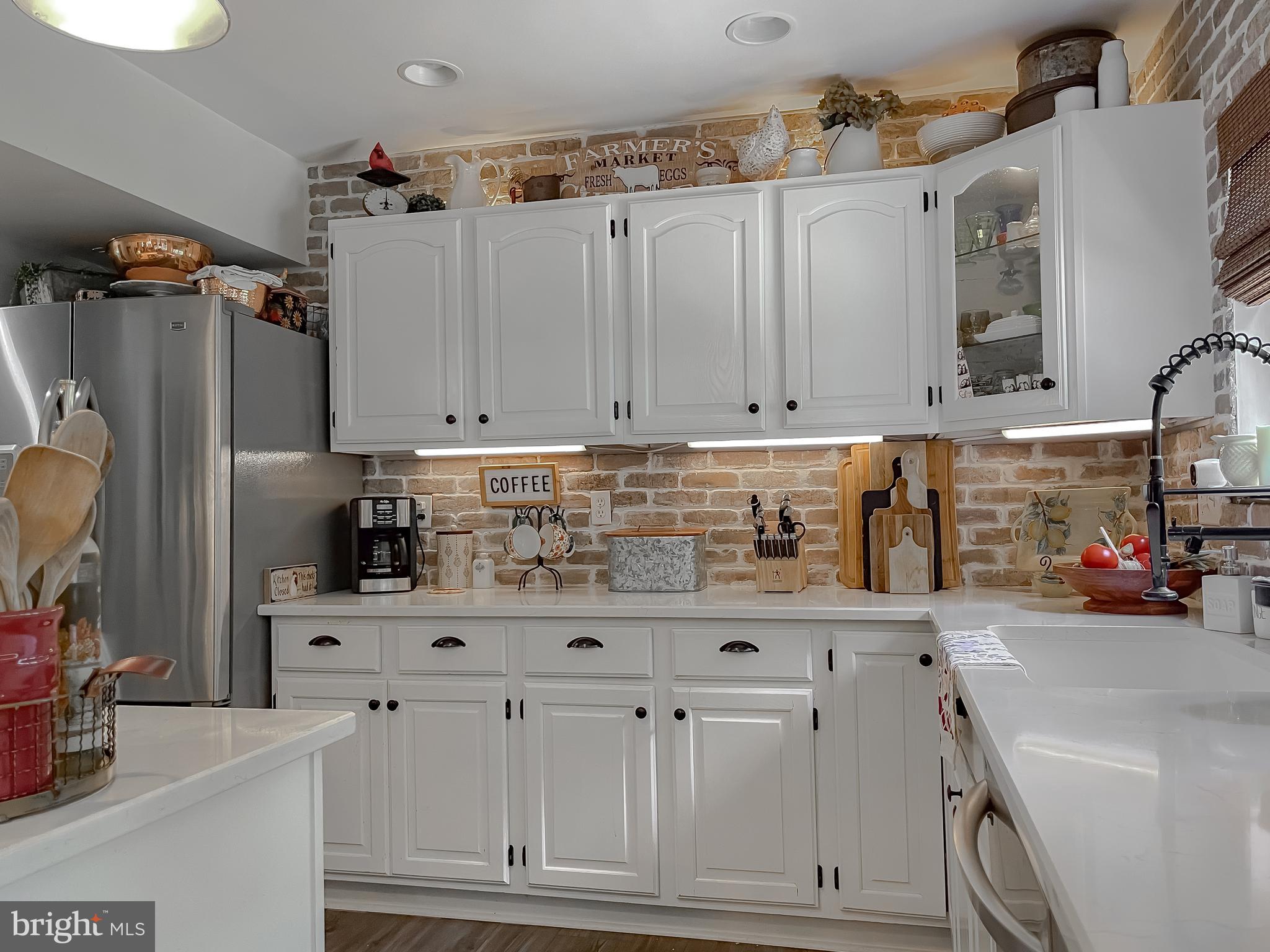 22338 White Oak Road Leonardtown, MD 20650 - Photo 22 of 66 a kitchen with stainless steel appliances cabinets and a counter top space