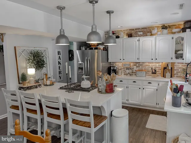 a bathroom with a sink mirror and vanity