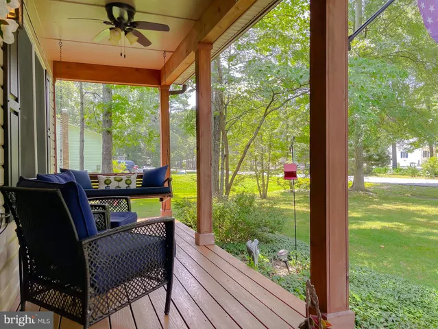 a view of a livingroom with furniture window and front door