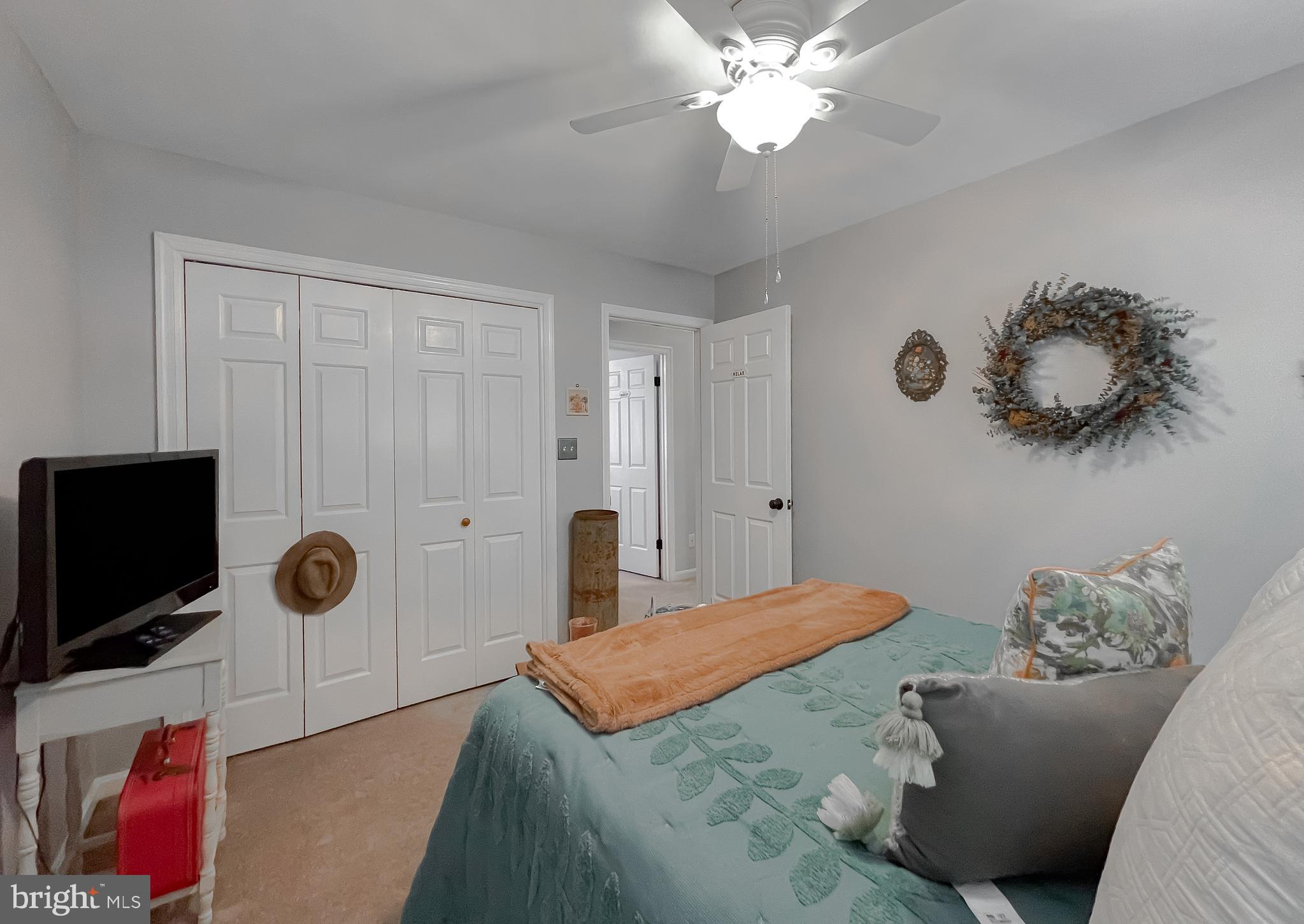 22338 White Oak Road Leonardtown, MD 20650 - Photo 31 of 66 a bedroom with a bed and a television