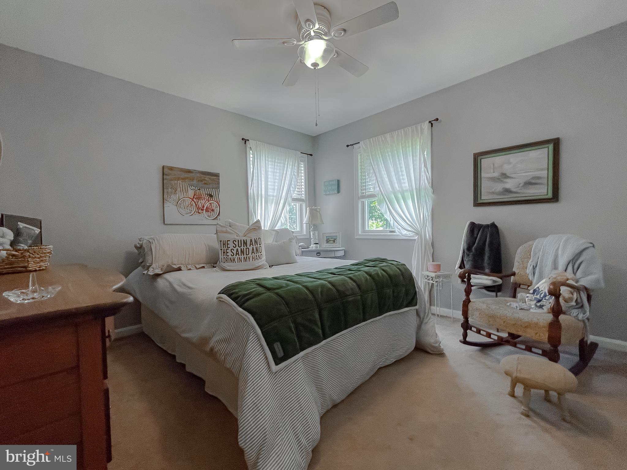 22338 White Oak Road Leonardtown, MD 20650 - Photo 35 of 66 a bedroom with a bed and a chandelier