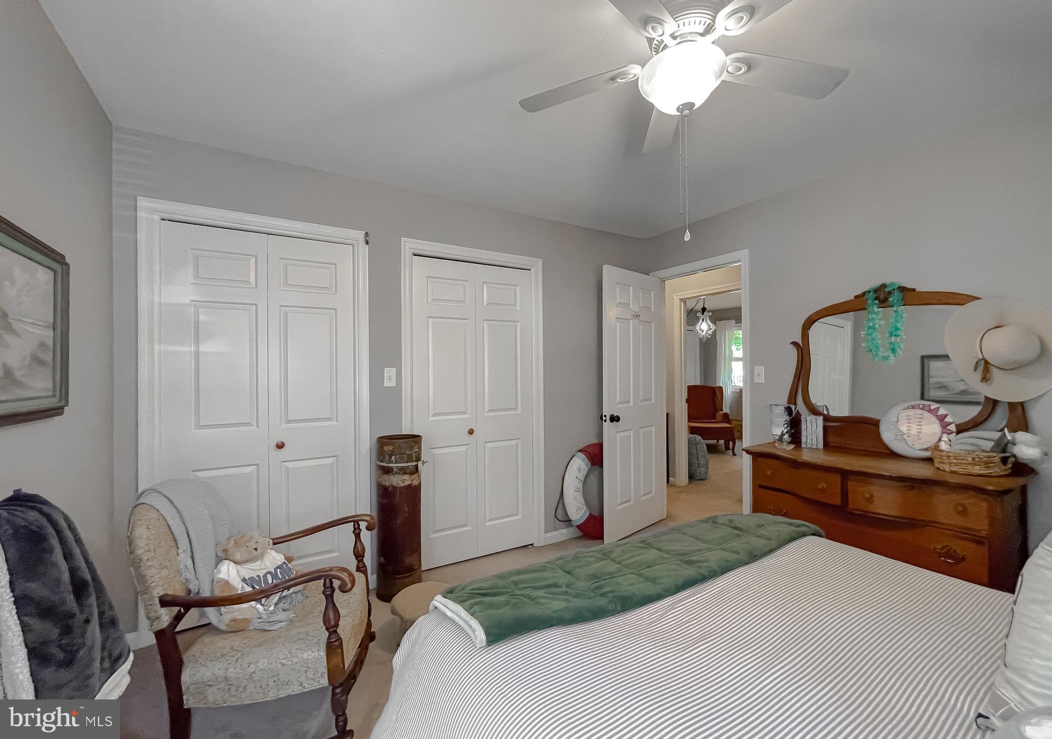 22338 White Oak Road Leonardtown, MD 20650 - Photo 37 of 66 a bedroom with bed and a chandelier