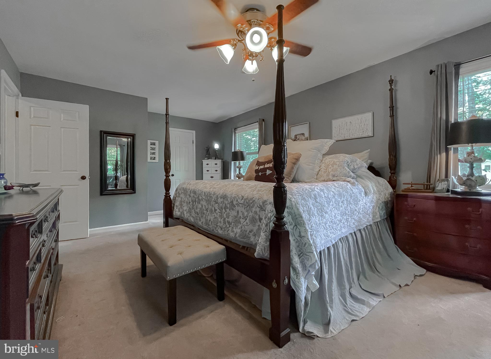 22338 White Oak Road Leonardtown, MD 20650 - Photo 40 of 66 a living room with furniture and a chandelier