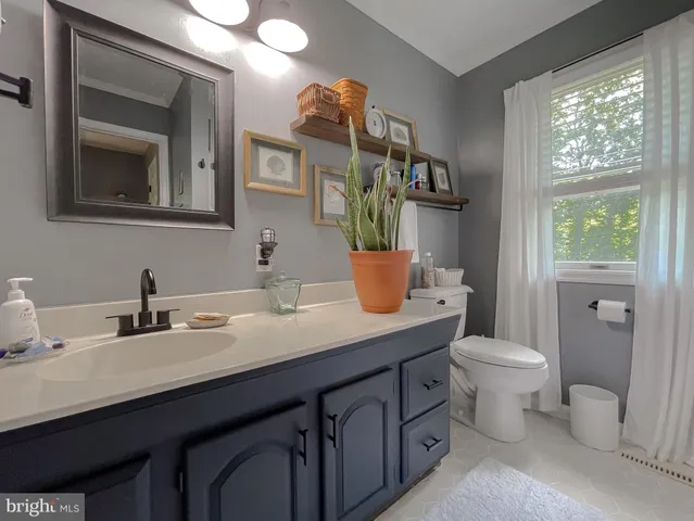 a view of a house with backyard porch and sitting area