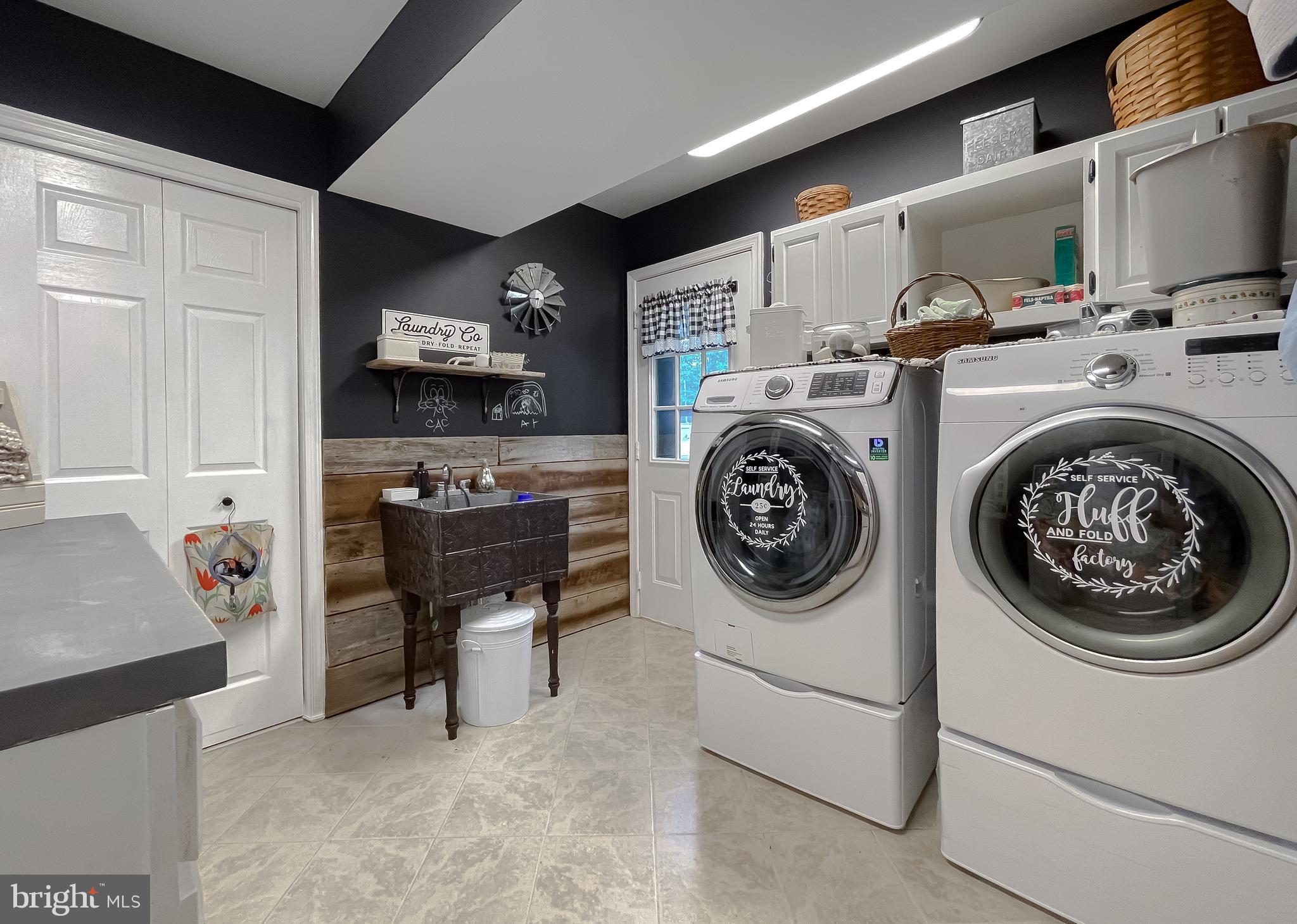 22338 White Oak Road Leonardtown, MD 20650 - Photo 47 of 66 a utility room with dryer washer and a view of living room