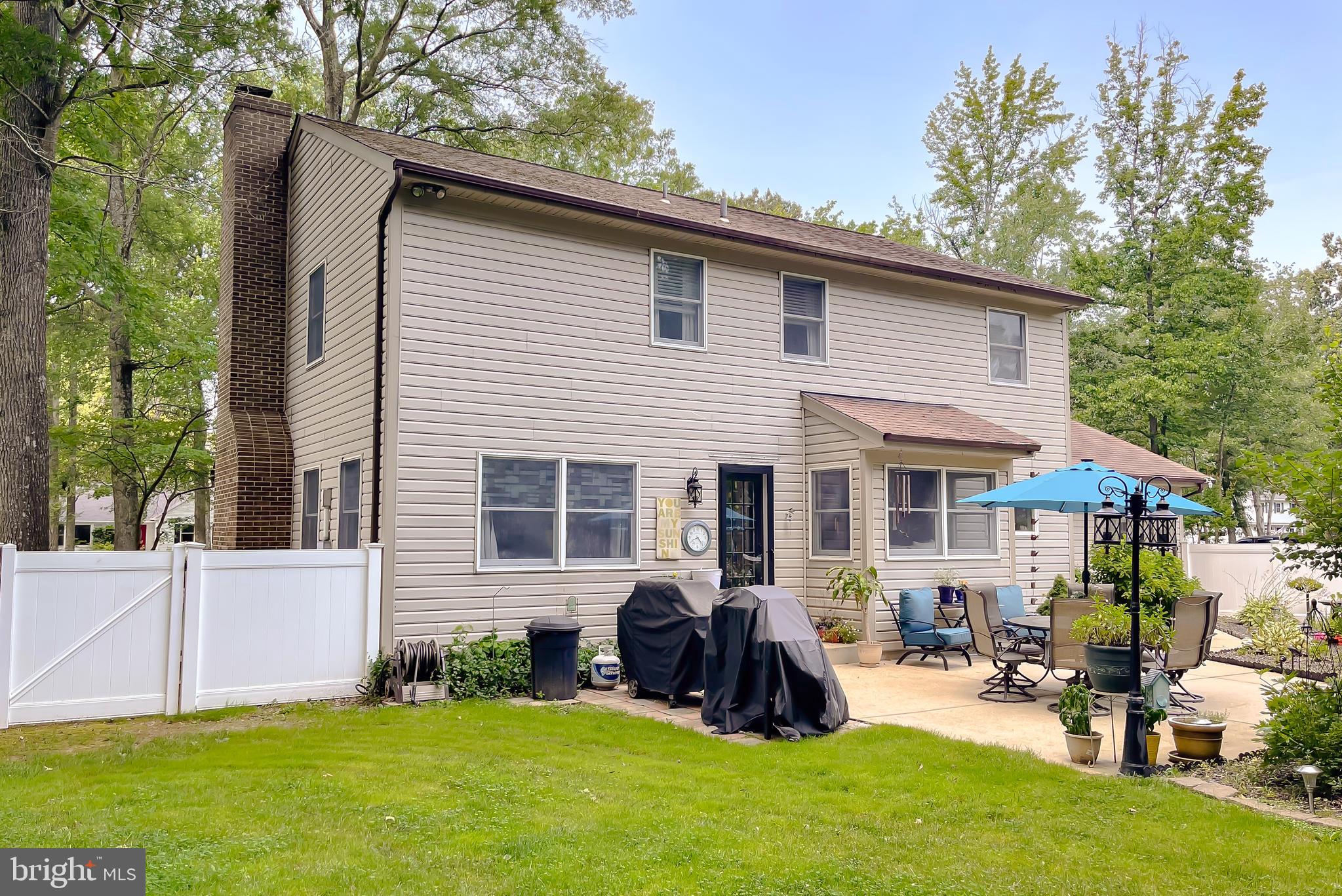 22338 White Oak Road Leonardtown, MD 20650 - Photo 49 of 66 a view of a house with a yard chairs and a patio
