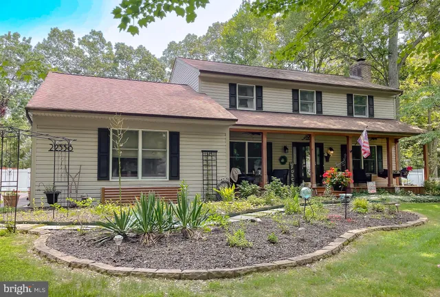 a view of a hallway with wooden floor and entryway