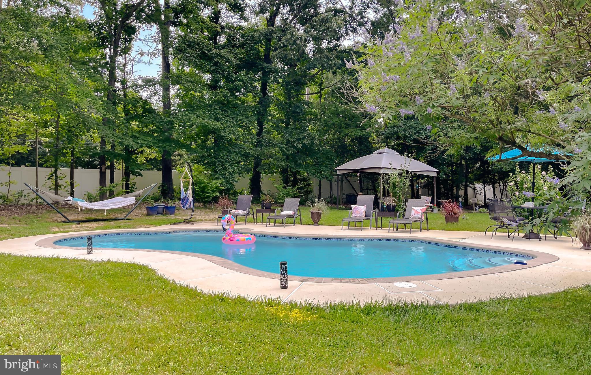 22338 White Oak Road Leonardtown, MD 20650 - Photo 60 of 66 a view of a swimming pool with an outdoor seating