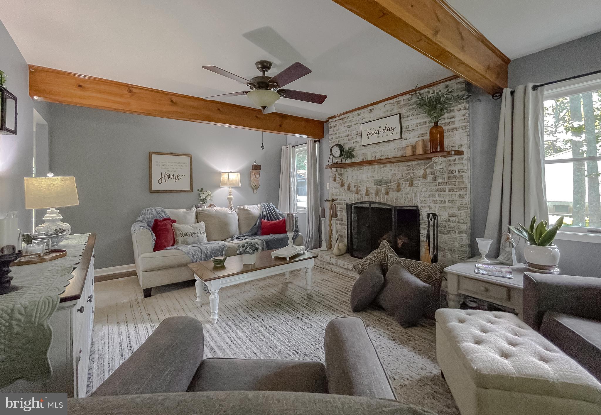 22338 White Oak Road Leonardtown, MD 20650 - Photo 9 of 66 a living room with furniture and a fireplace