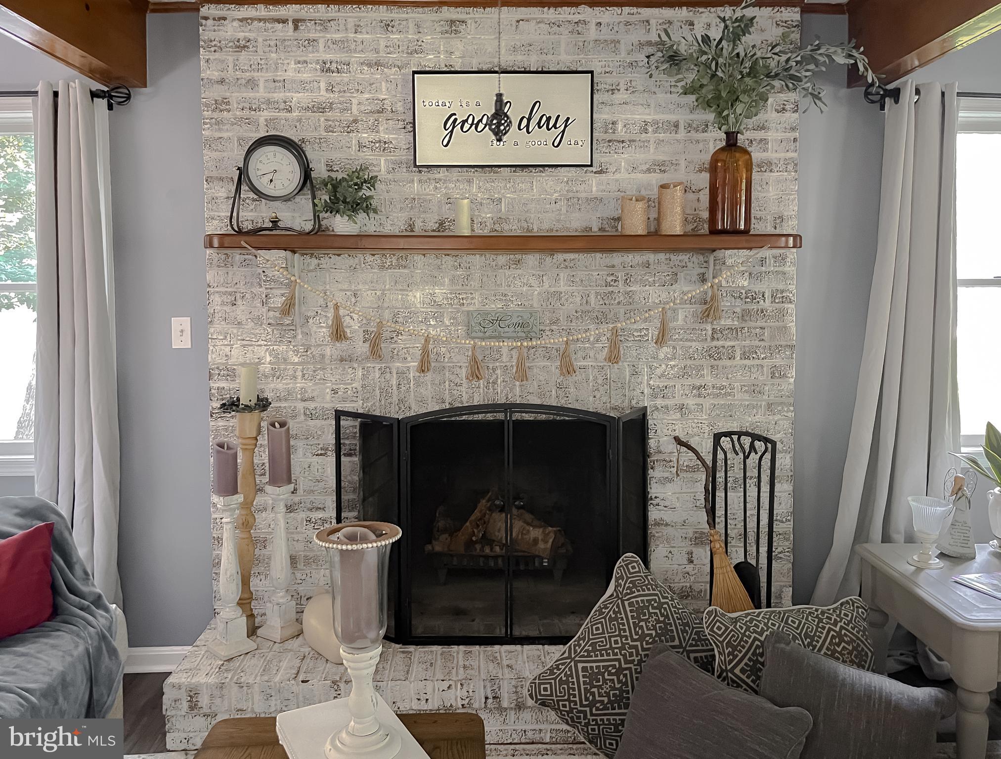 22338 White Oak Road Leonardtown, MD 20650 - Photo 10 of 66 a living room with furniture and a fireplace