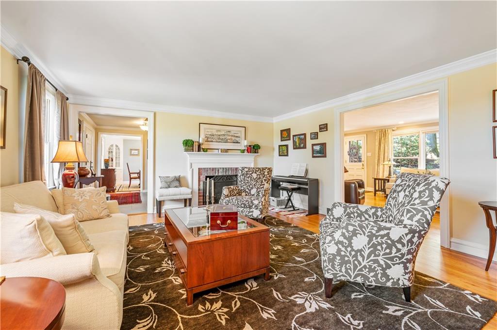 104 Ascot Place Pittsburgh, PA 15237 - Photo 11 of 26 a living room with furniture large window and a fireplace
