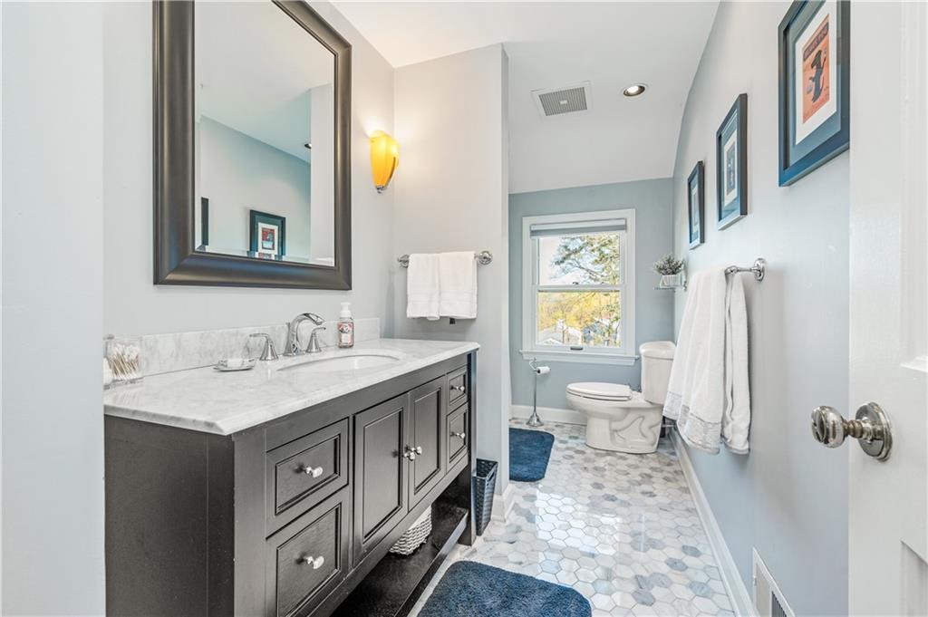 104 Ascot Place Pittsburgh, PA 15237 - Photo 13 of 26 a bathroom with a sink and a mirror