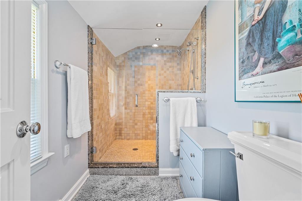 104 Ascot Place Pittsburgh, PA 15237 - Photo 20 of 26 a bathroom with a granite countertop sink a mirror and shower