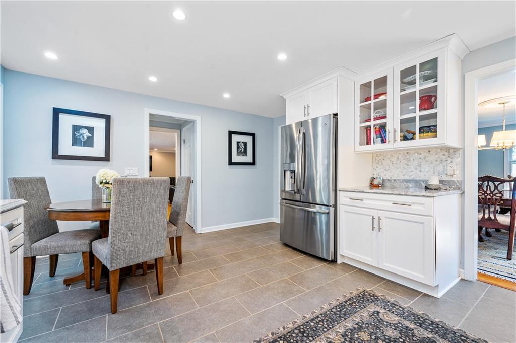 104 Ascot Place Pittsburgh, PA 15237 - Photo 5 of 26 a living room with stainless steel appliances furniture a rug and a window