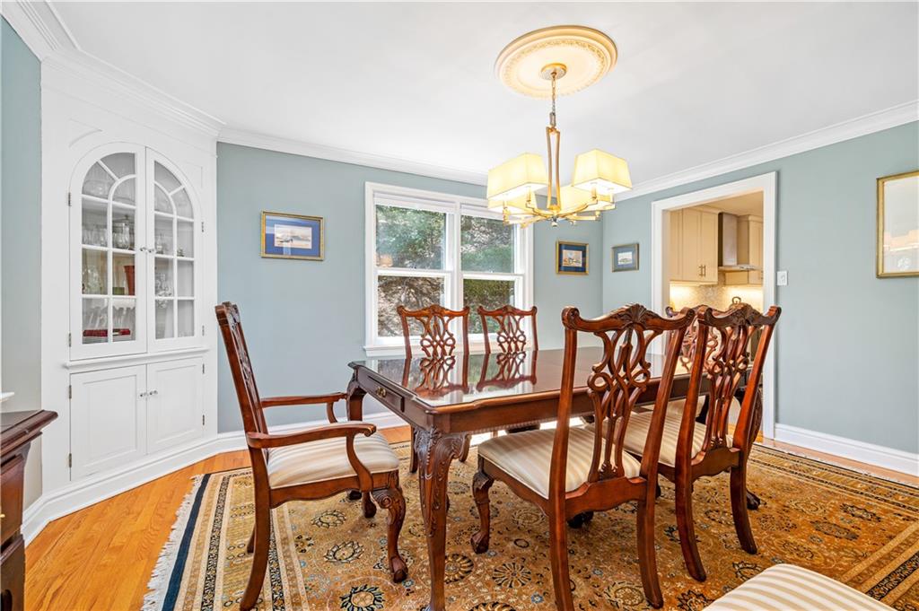 104 Ascot Place Pittsburgh, PA 15237 - Photo 6 of 26 a dining room with furniture a chandelier and wooden floor