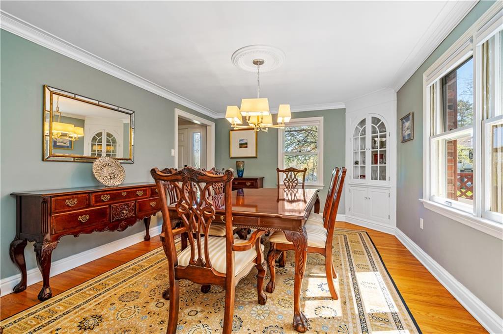 104 Ascot Place Pittsburgh, PA 15237 - Photo 7 of 26 a dining room with furniture a chandelier and wooden floor