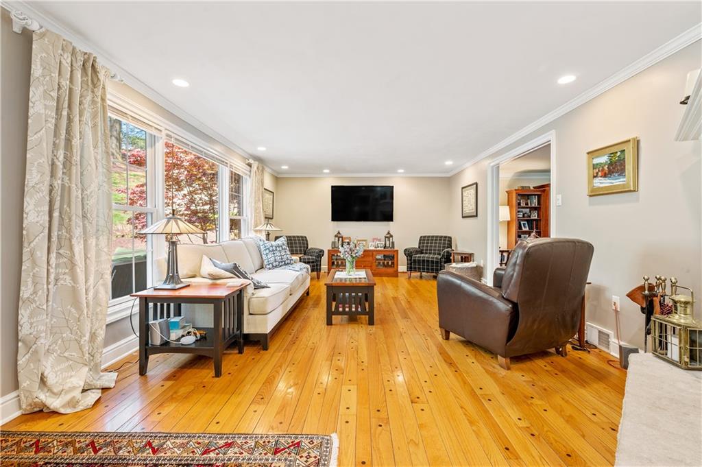 104 Ascot Place Pittsburgh, PA 15237 - Photo 8 of 26 a living room with furniture hard wood floor and a flat screen tv