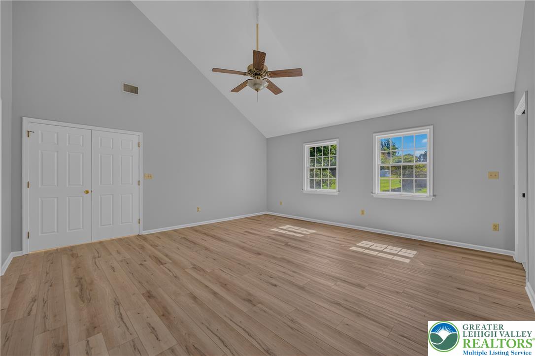 630 Clearfield Road Nazareth, PA 18064 - Photo 46 of 100 Soaring vaulted ceilings and durable wood-look flooring define this versatile main living area.
