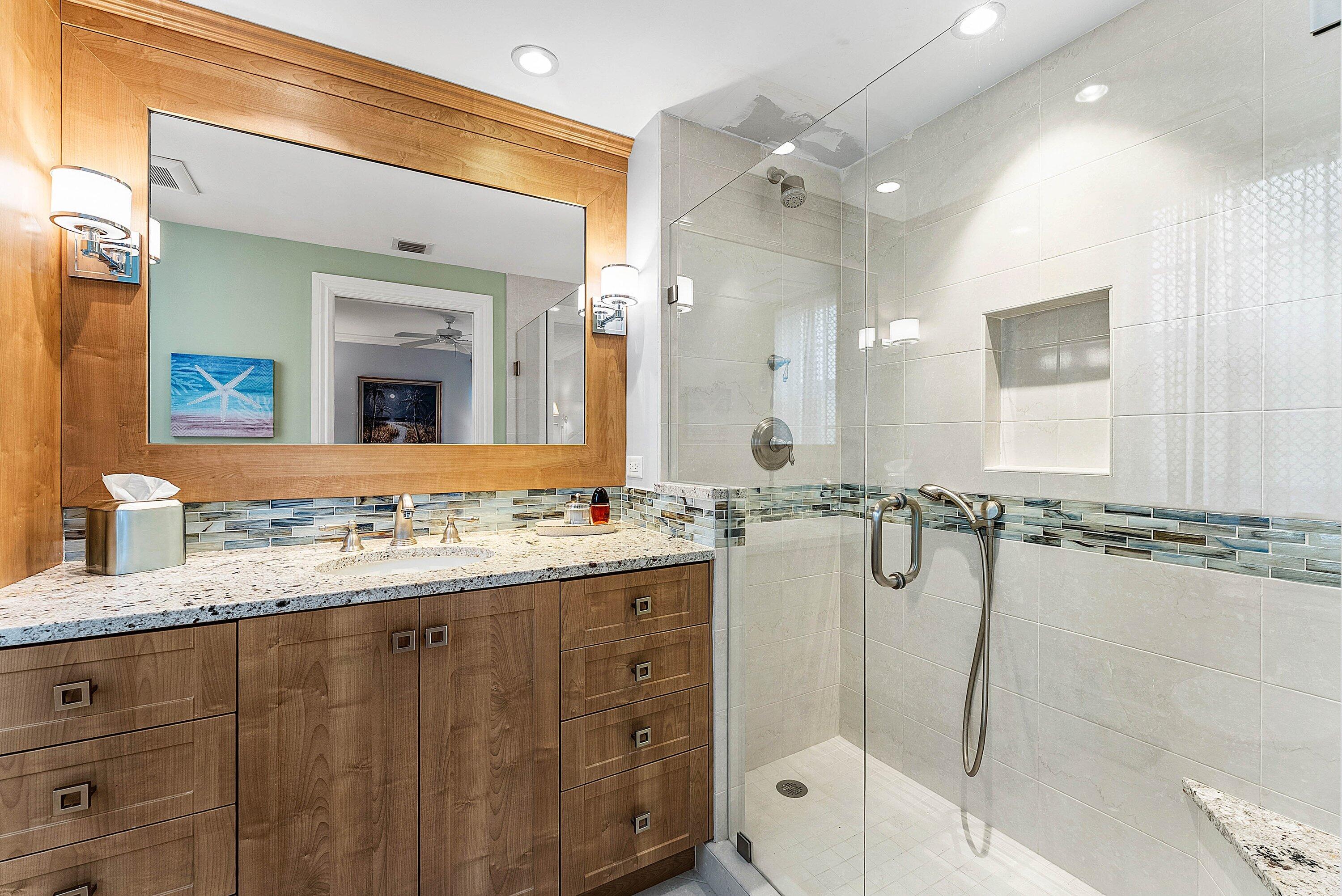 2103 South Ocean Boulevard, Unit 4B Delray Beach, FL 33483 - Photo 16 of 46 a bathroom with a granite countertop sink mirror and double