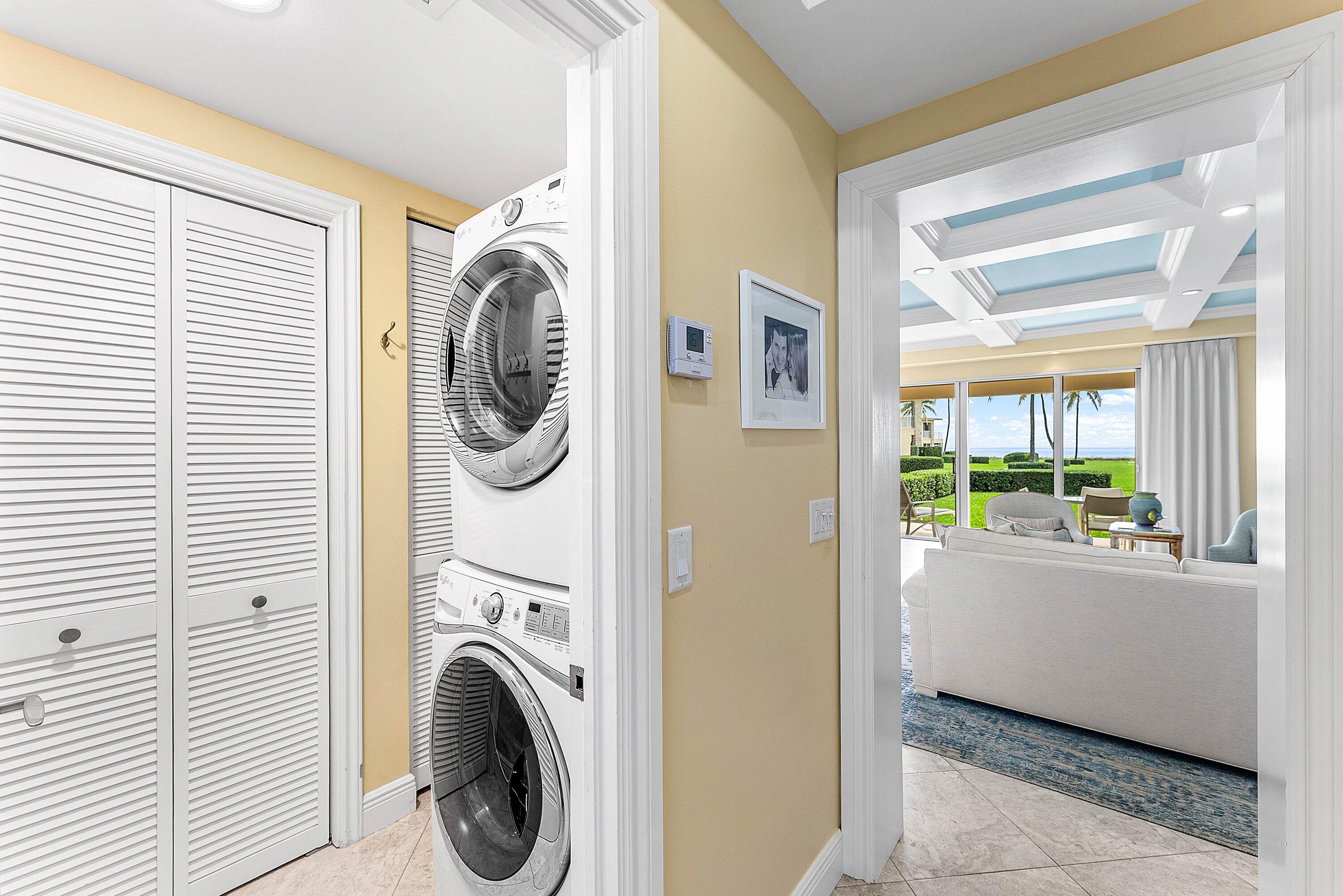 2103 South Ocean Boulevard, Unit 4B Delray Beach, FL 33483 - Photo 17 of 46 a utility room with dryer and washer