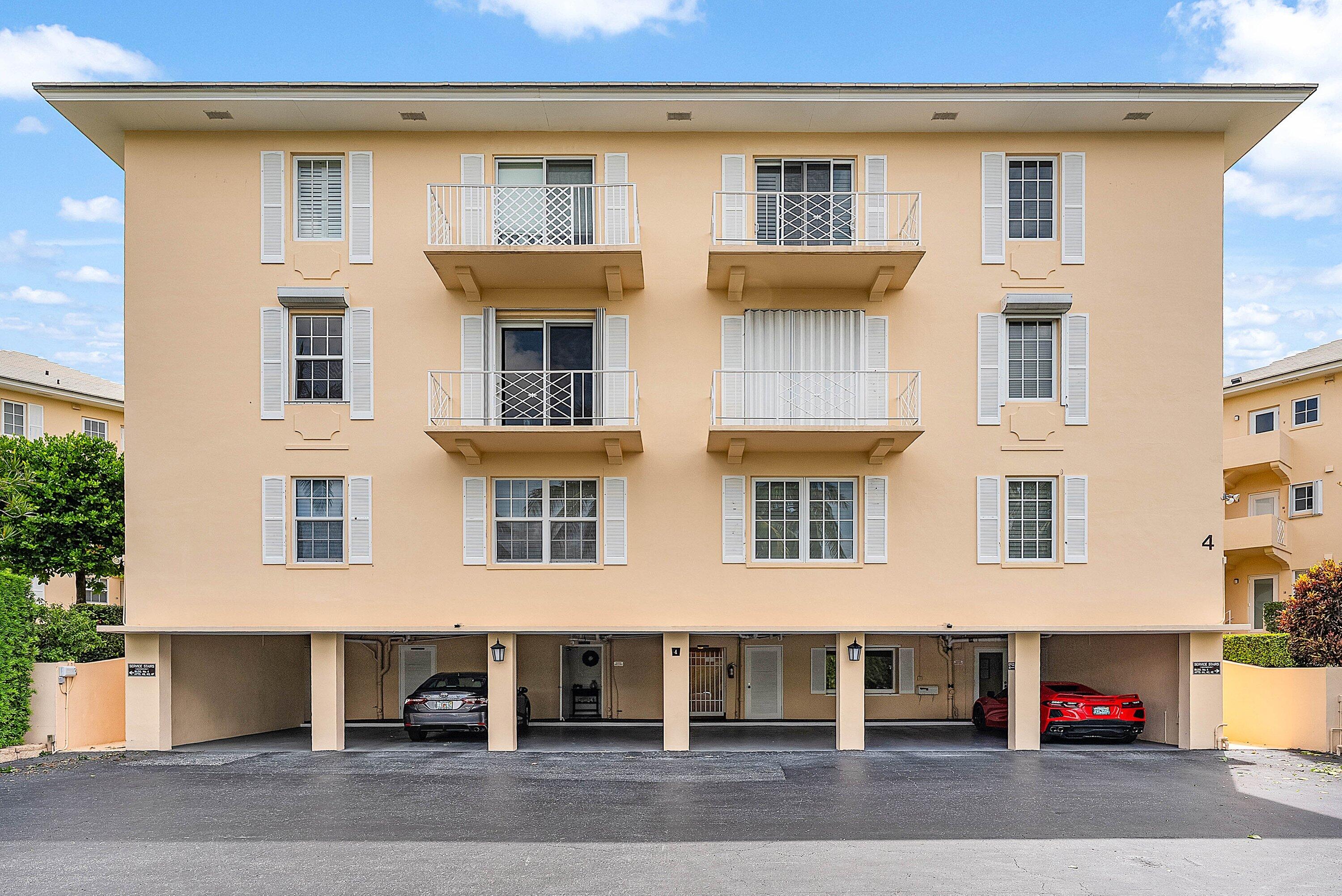 2103 South Ocean Boulevard, Unit 4B Delray Beach, FL 33483 - Photo 33 of 46 a view of a building with a parking area