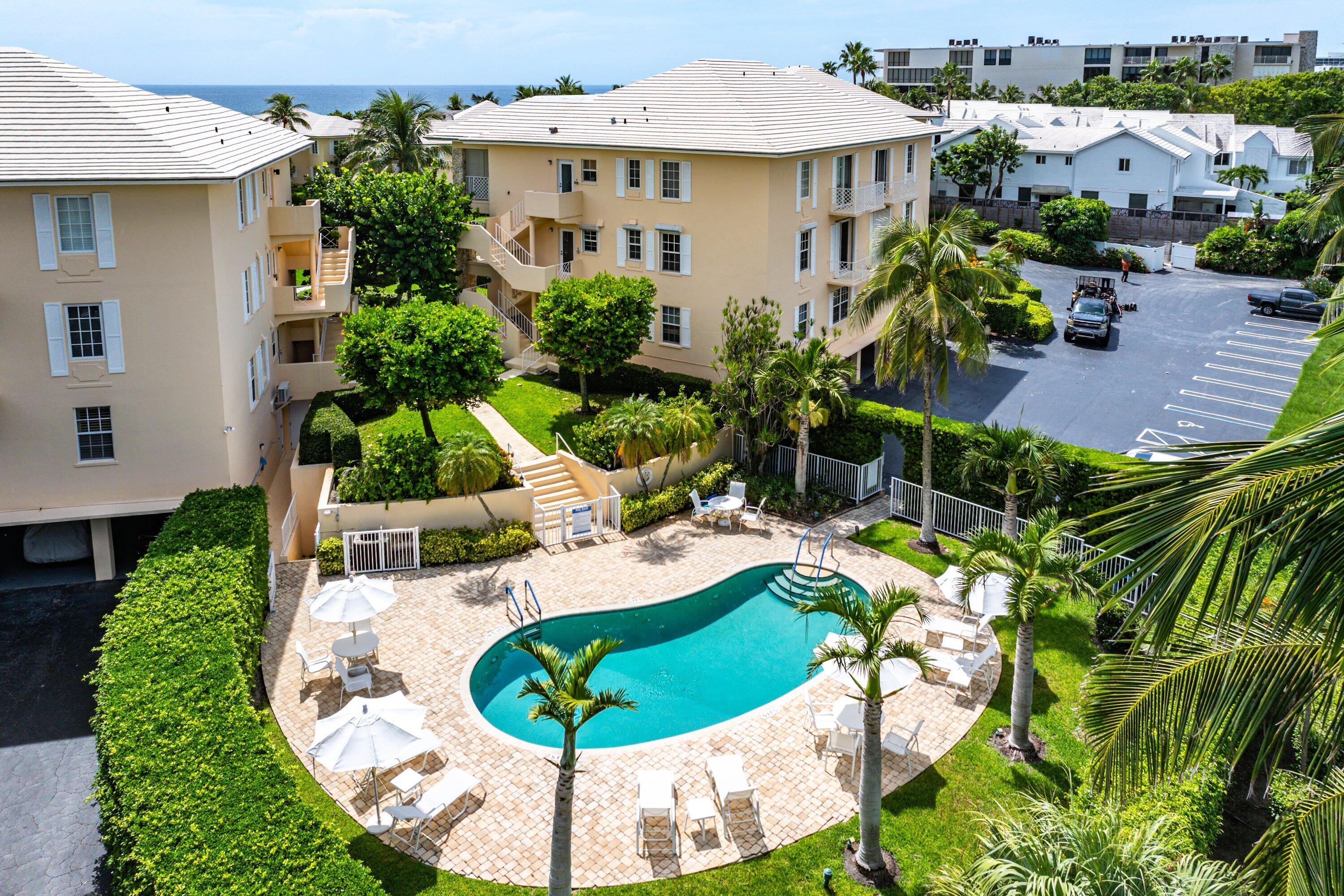 2103 South Ocean Boulevard, Unit 4B Delray Beach, FL 33483 - Photo 37 of 46 an aerial view of a house with swimming pool garden and patio