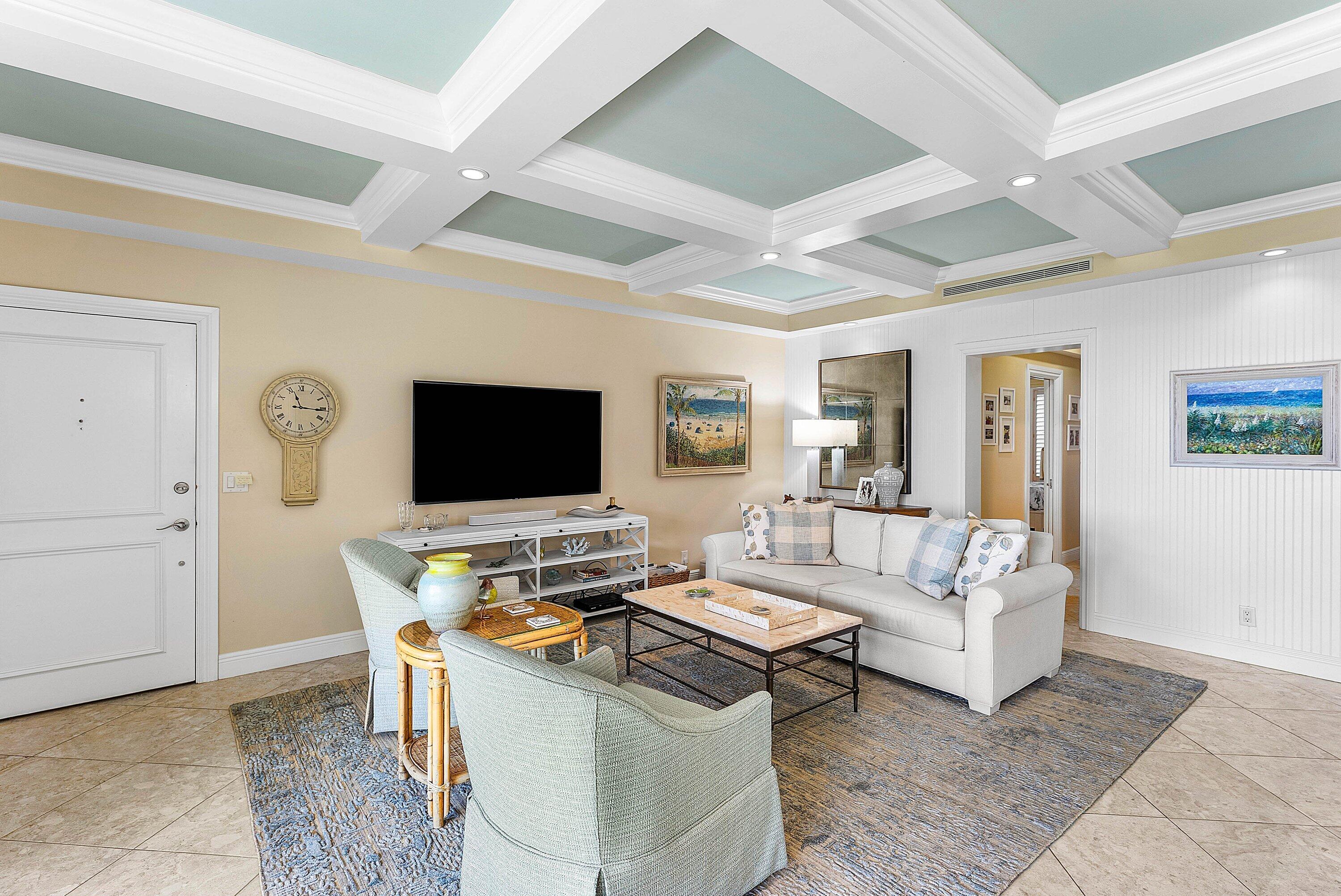 2103 South Ocean Boulevard, Unit 4B Delray Beach, FL 33483 - Photo 6 of 46 a living room with furniture and a flat screen tv