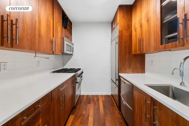 a kitchen with a sink and a window