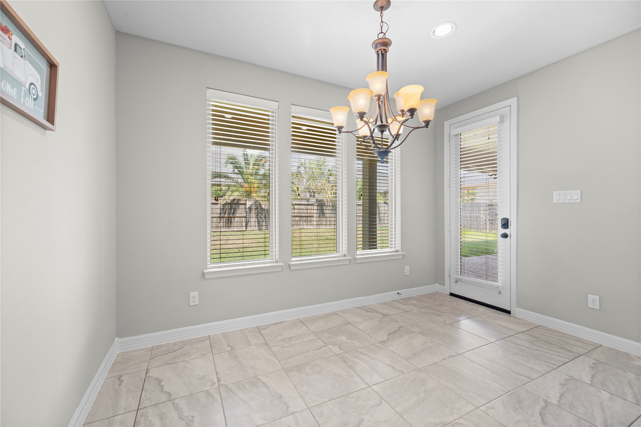 27506 Windcrest Key Lane Fulshear, TX 77441 - Photo 16 of 30 a view of an empty room with a window
