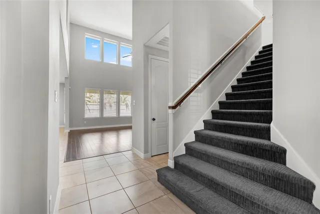 a view of entryway and hall with a rug