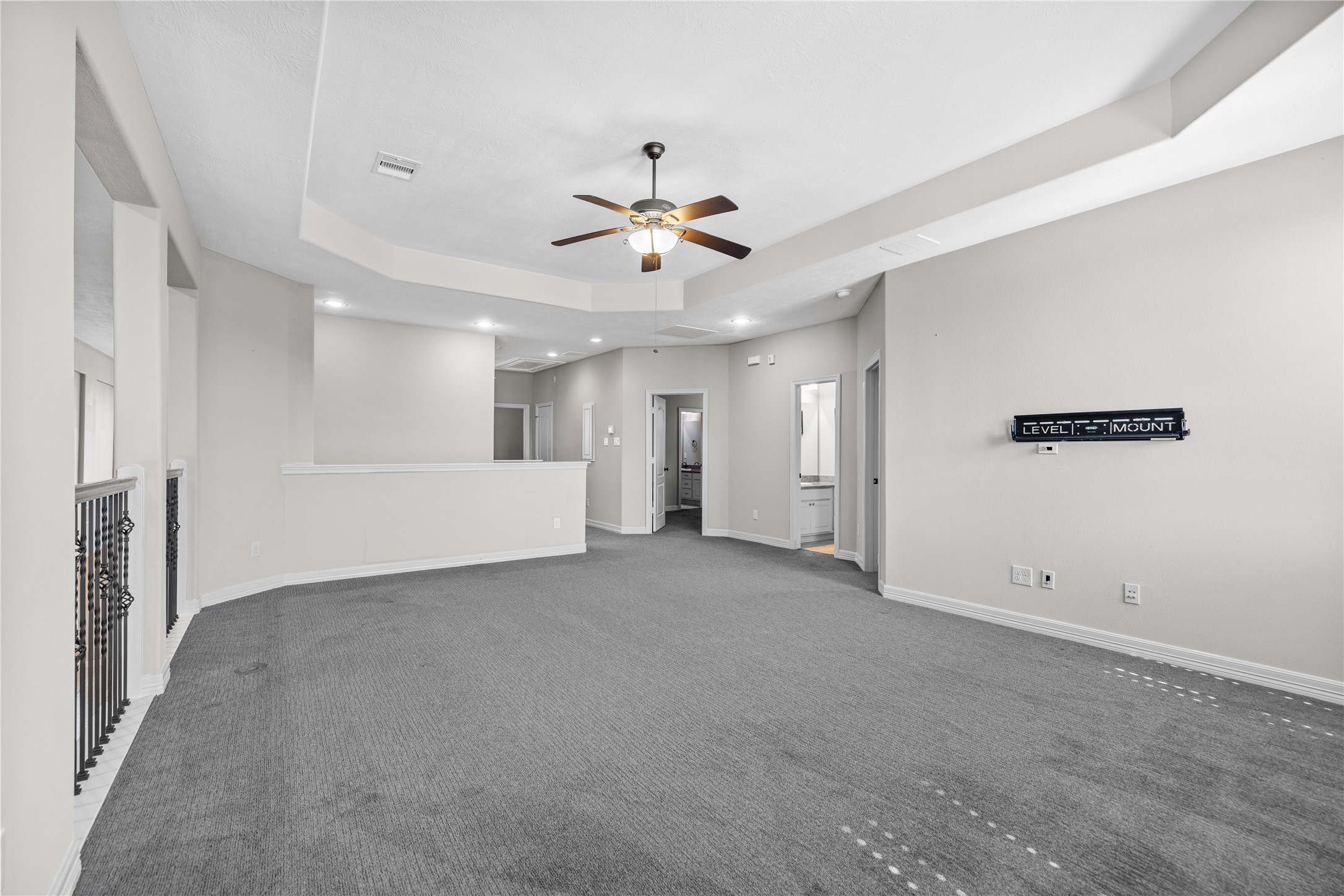 27506 Windcrest Key Lane Fulshear, TX 77441 - Photo 23 of 30 an empty room with a empty space and a ceiling fan