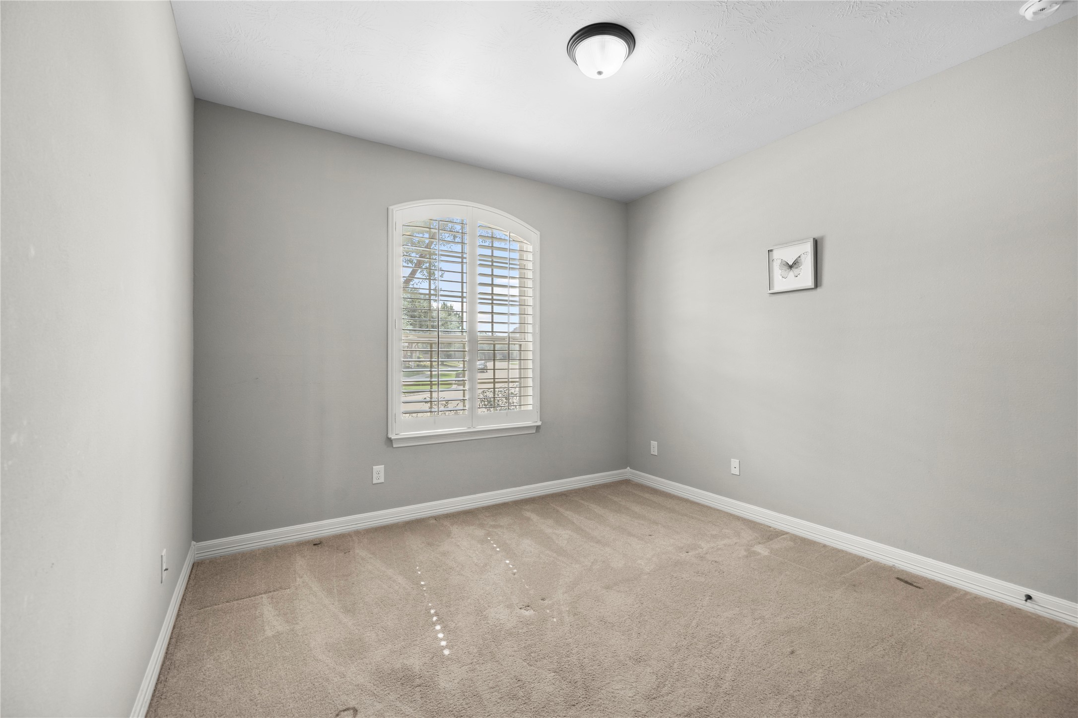 27506 Windcrest Key Lane Fulshear, TX 77441 - Photo 27 of 30 an empty room with a window
