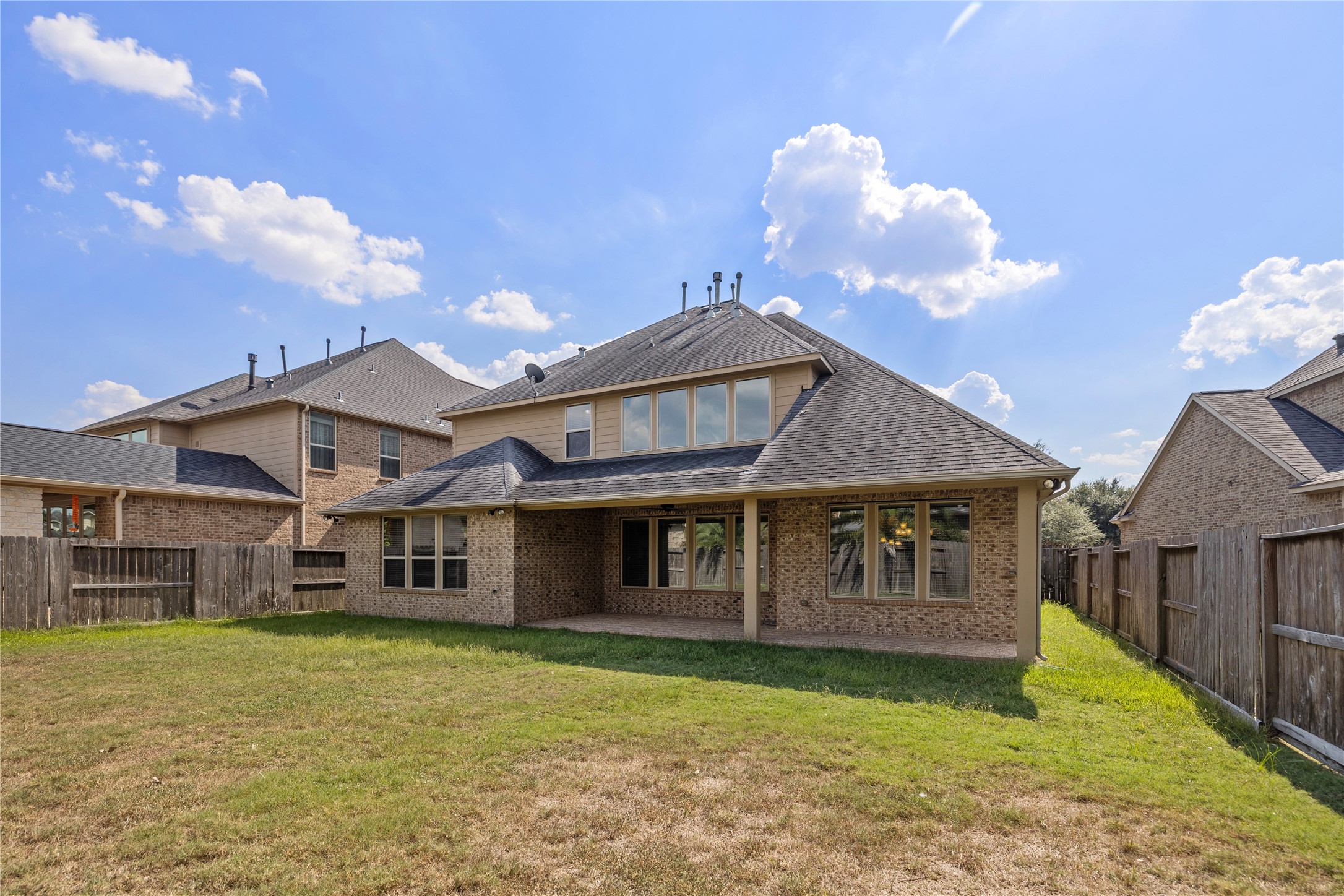 27506 Windcrest Key Lane Fulshear, TX 77441 - Photo 30 of 30 a front view of a house with a garden