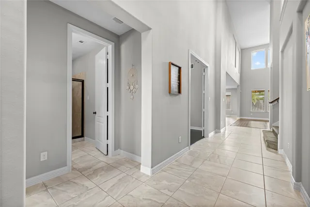 a view of a bathroom with a shower and a sink